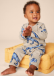 Tea Collection Long Sleeve Pocket Baby Romper T-Rex In Marble on Sale